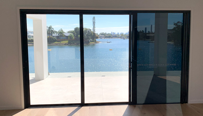Gold Coast Security Screens installation maintenance - tripple sliding door with security screen