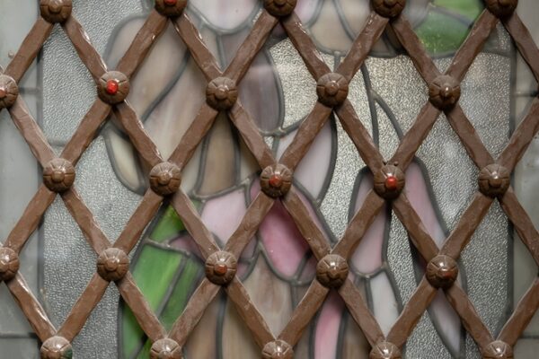Early-window-security-decorative-iron-diamond-grill-on-stainglass-Security-screens-for-windows-Gold-Coast