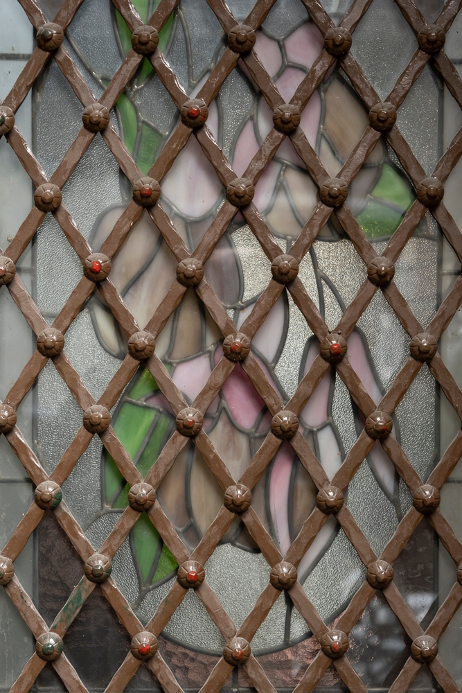 Early-window-security-decorative-iron-diamond-grill-on-stainglass-Security-screens-for-windows-Gold-Coast