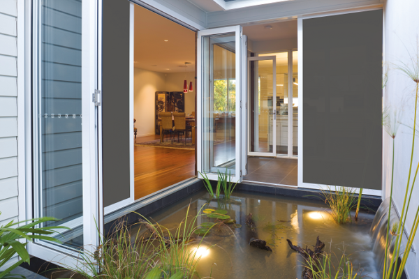 Vision-Gard-sliding-door-system-around-a-water-feature-suburban-security-screens-Gold-Coast